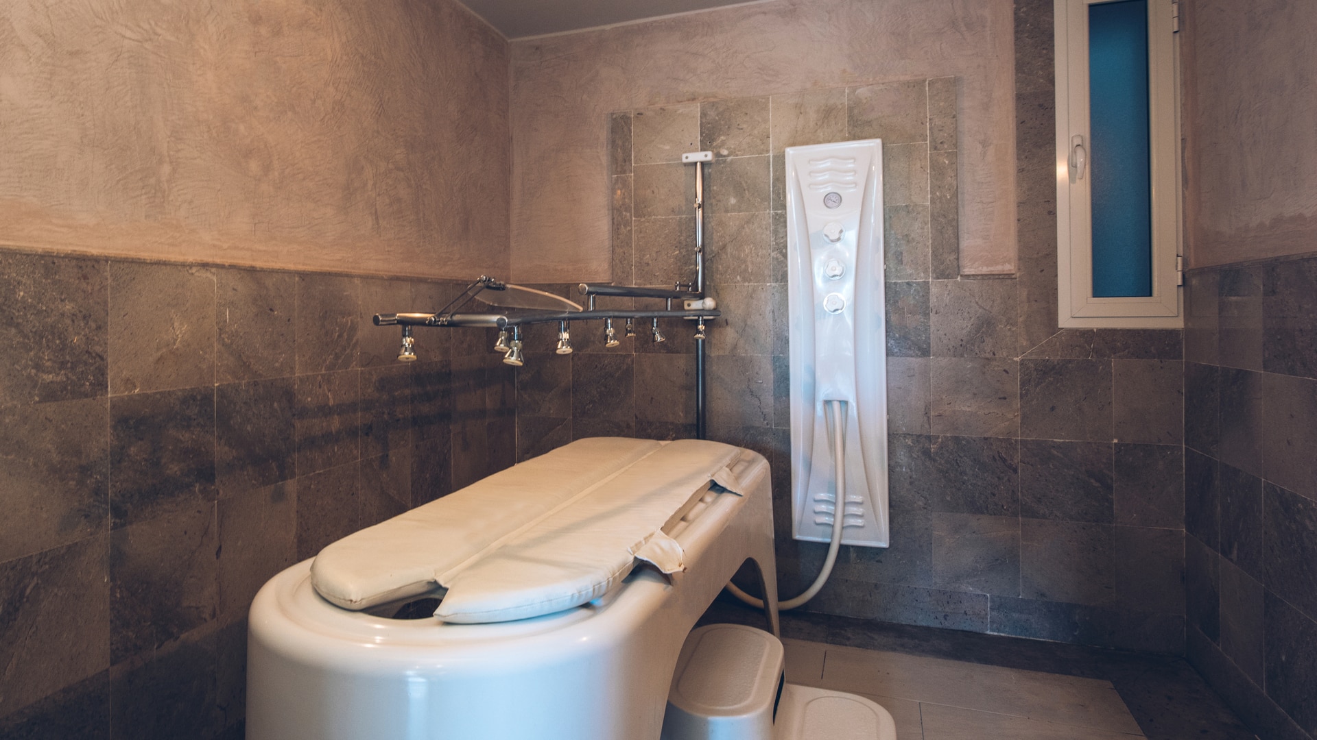 a white sink in a small room