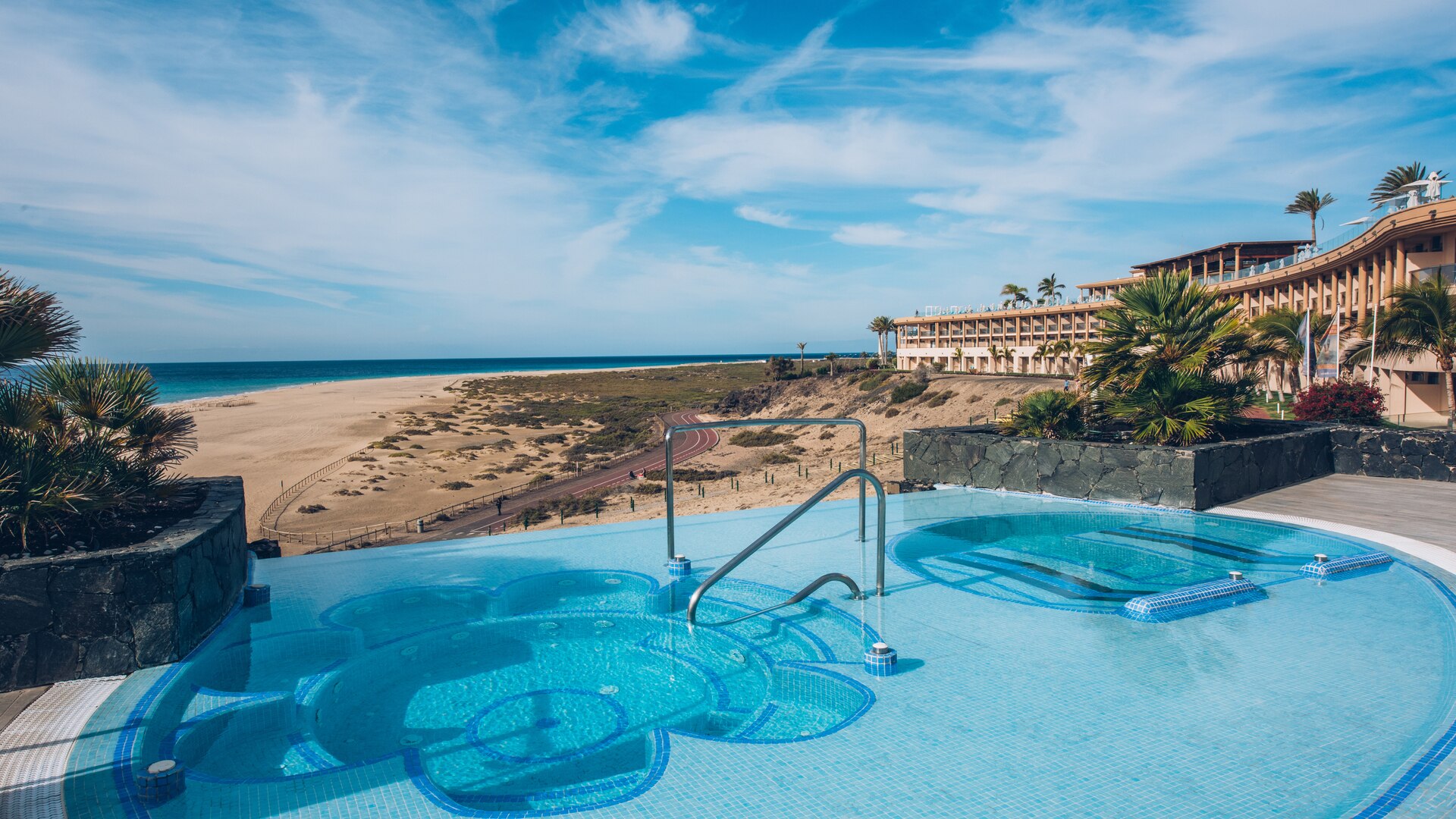 a pool next to a body of water