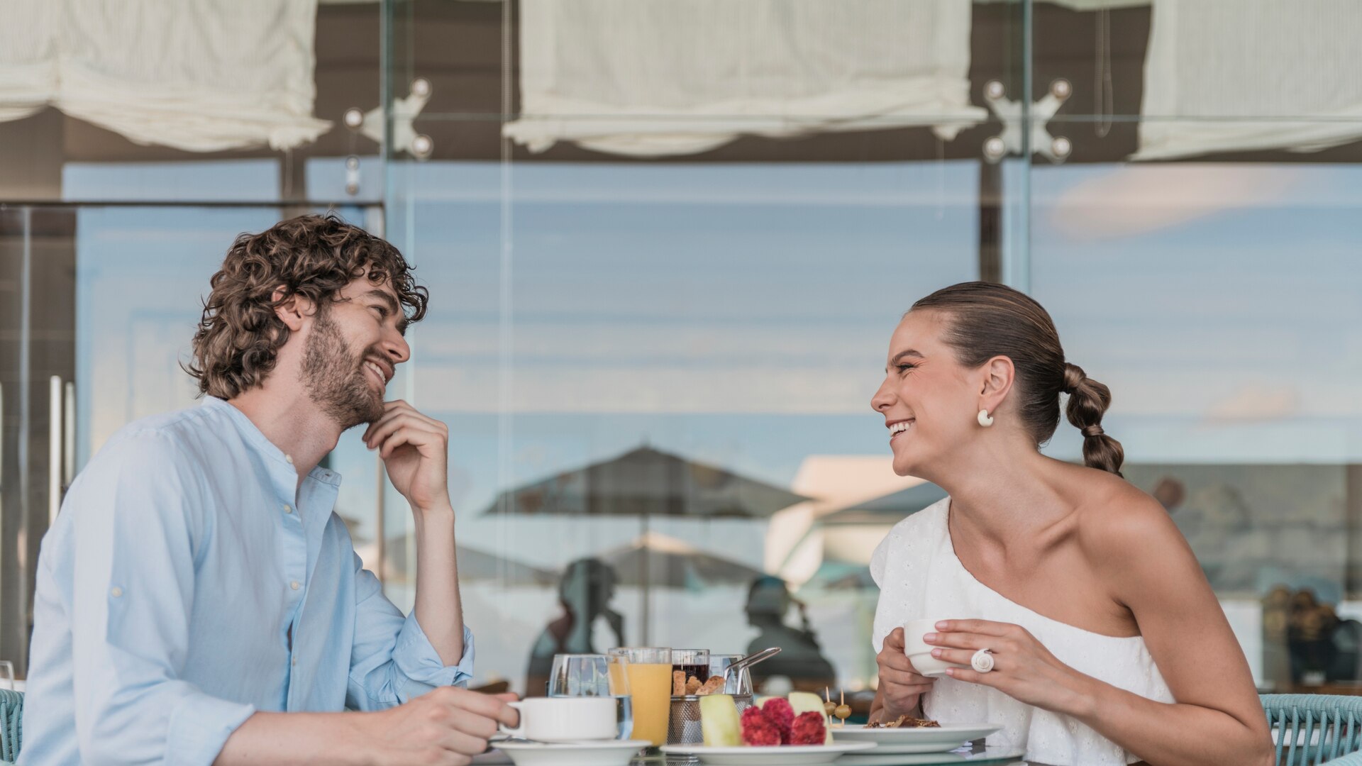 A couple diving in the sea for their honeymoon