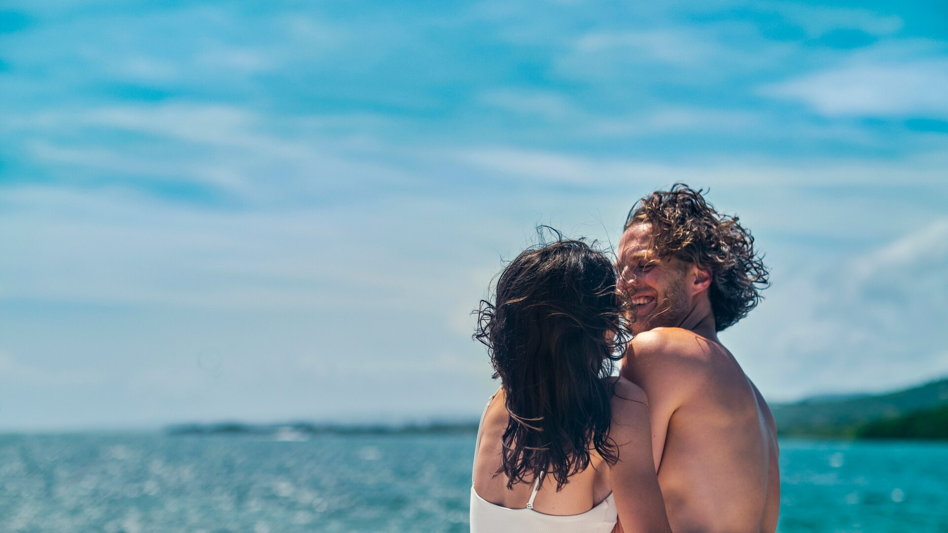 a group of people standing around a table