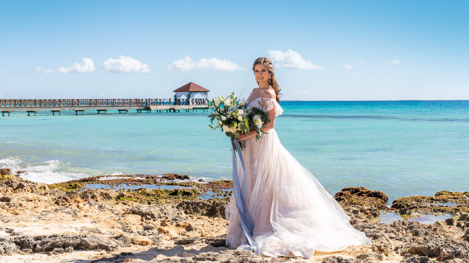a person standing on top of a sandy beach