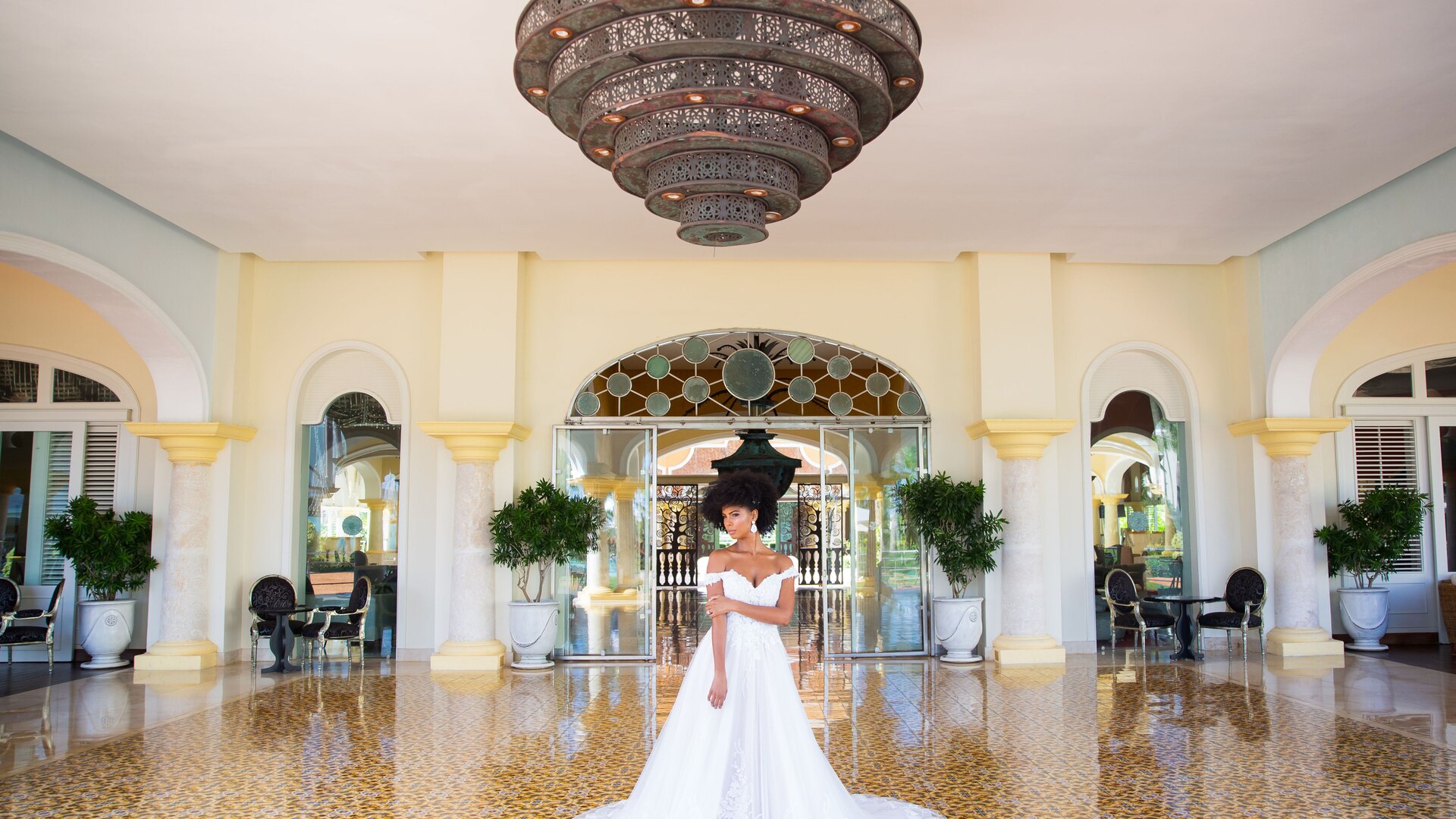 a room filled with furniture and vase of flowers on a table