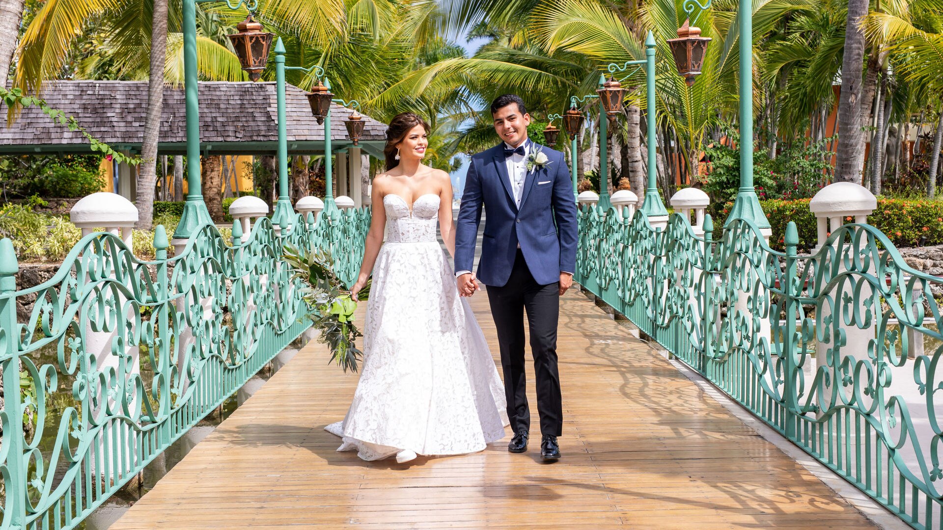 a person standing next to a palm tree