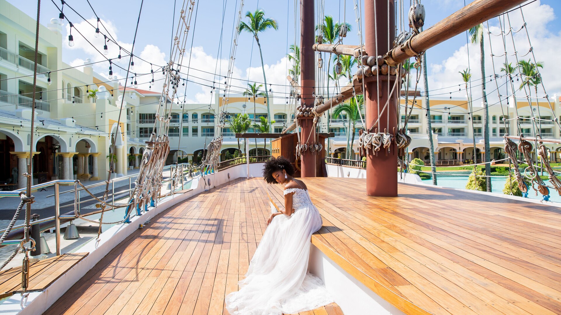 a person sitting at a table in front of a building