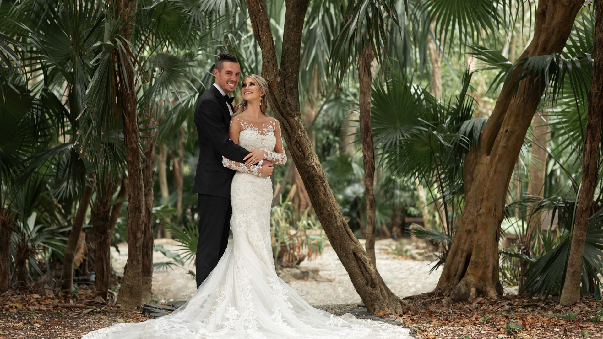 a man standing next to a tree