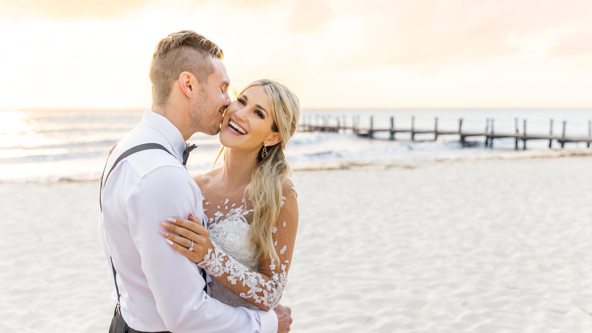 a man standing next to a body of water