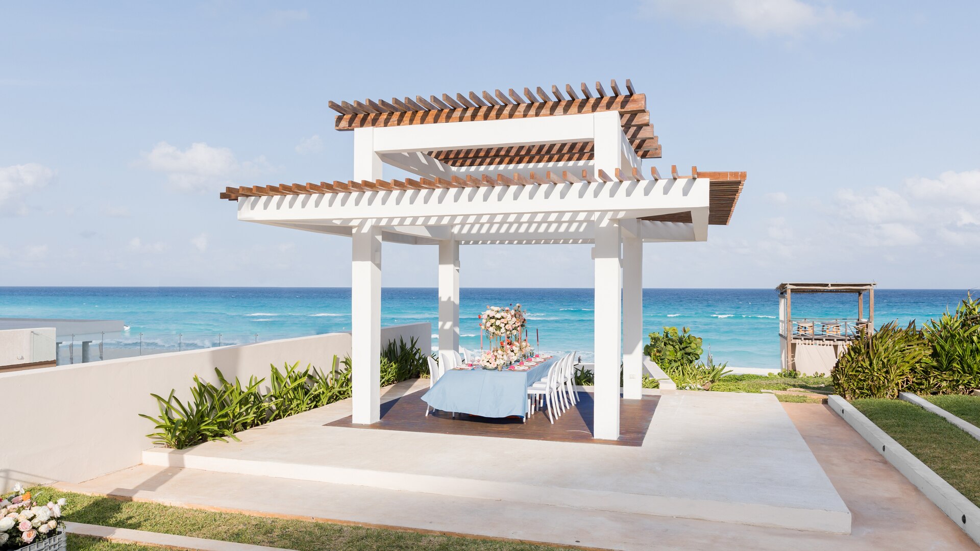 a building next to the ocean