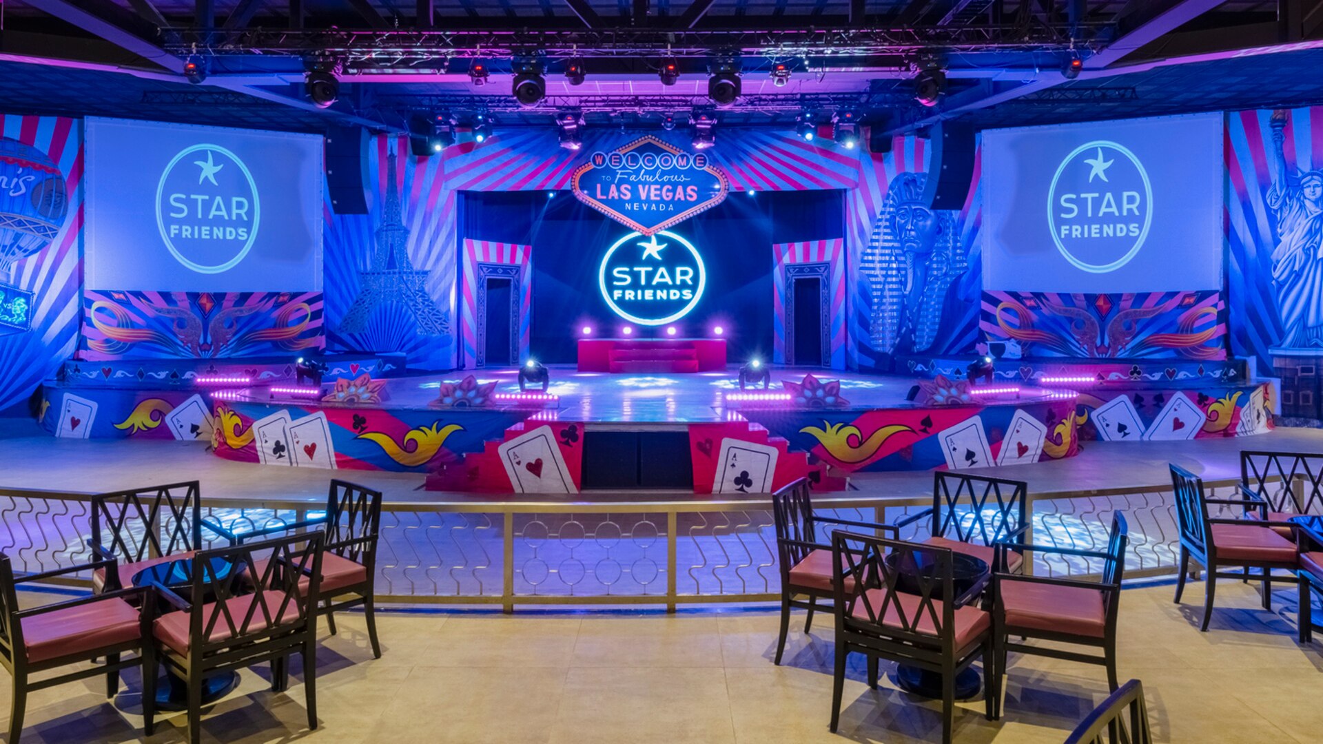 a person wearing a blue dress standing in front of a curtain