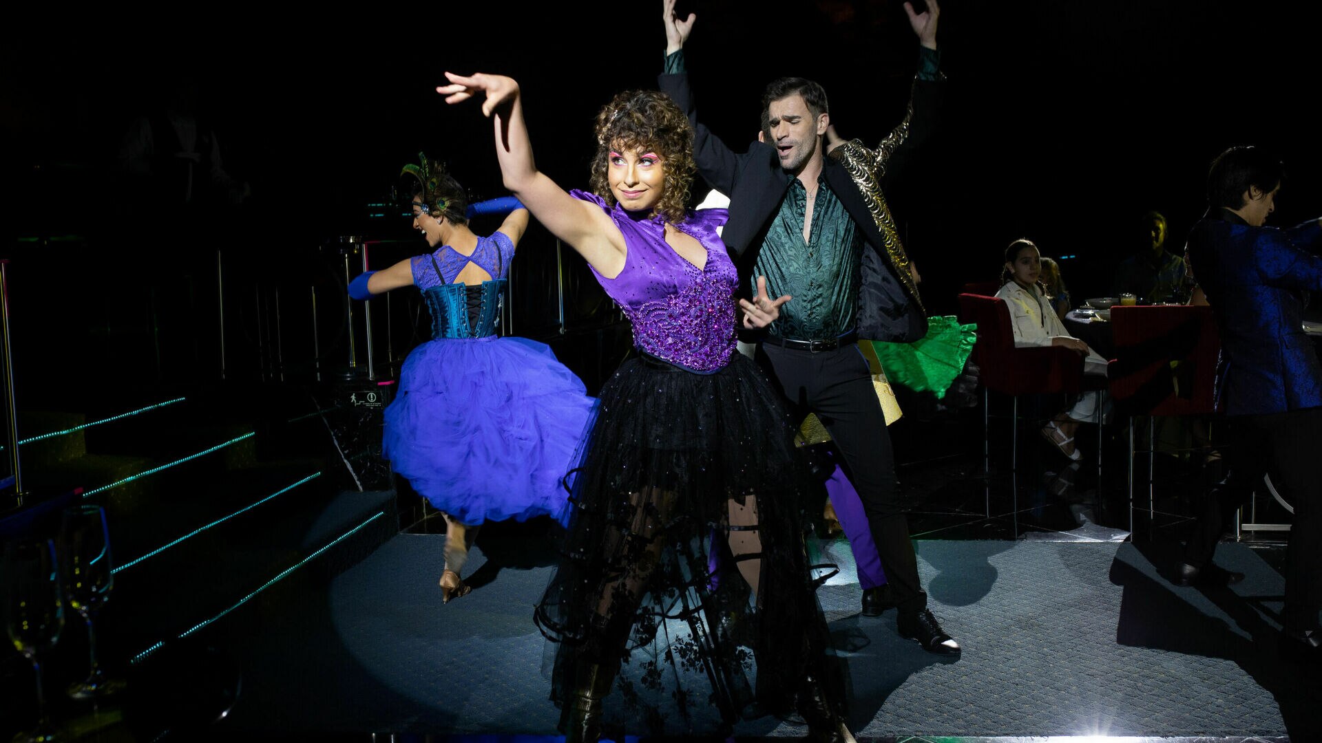 a man and a woman standing on a stage
