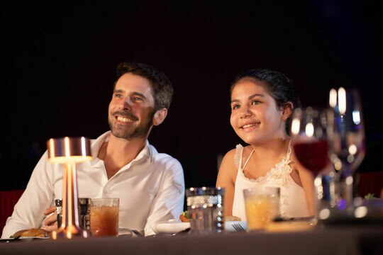 a couple of people sitting at a table