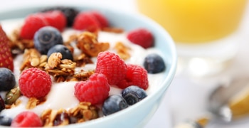 a close up of a bowl of fruit on a plate