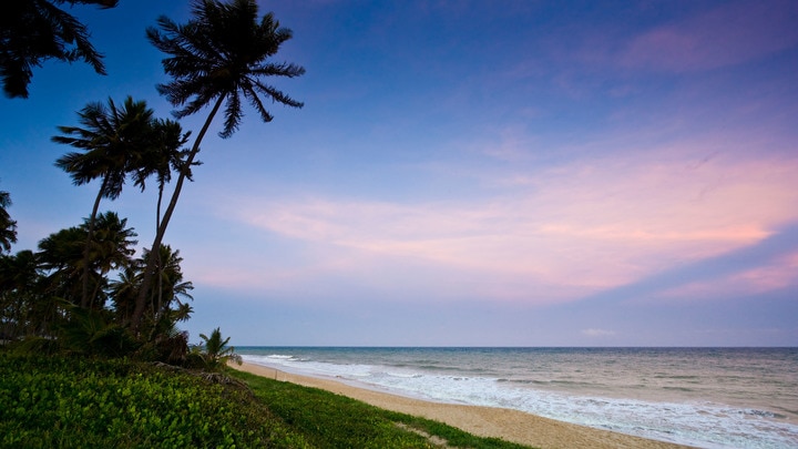 a beach next to a body of water