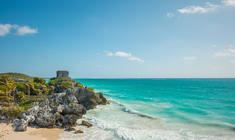 a rocky shore next to a body of water