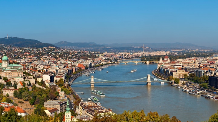 a large body of water with a city in the background