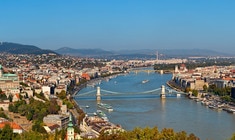 a large body of water with a city in the background