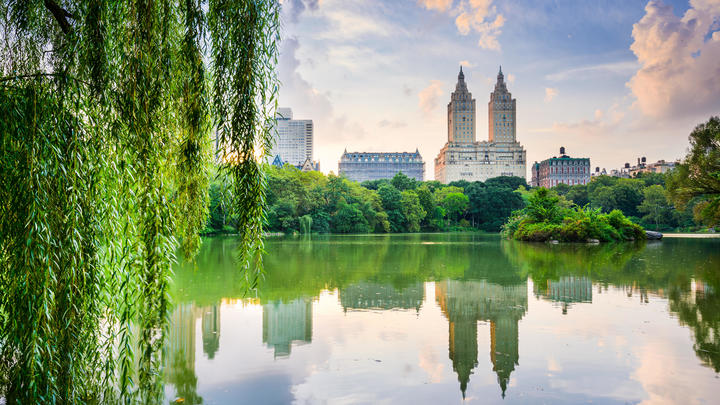 a castle with water in front of a lake