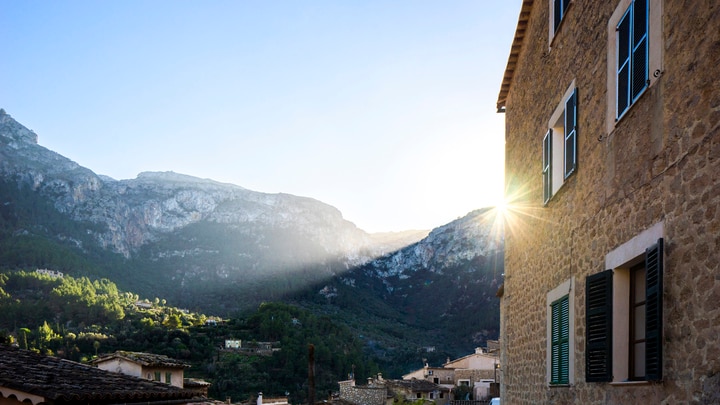 a building with a mountain in the background