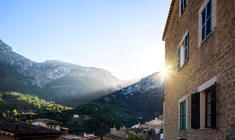 a building with a mountain in the background