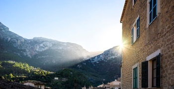 a building with a mountain in the background