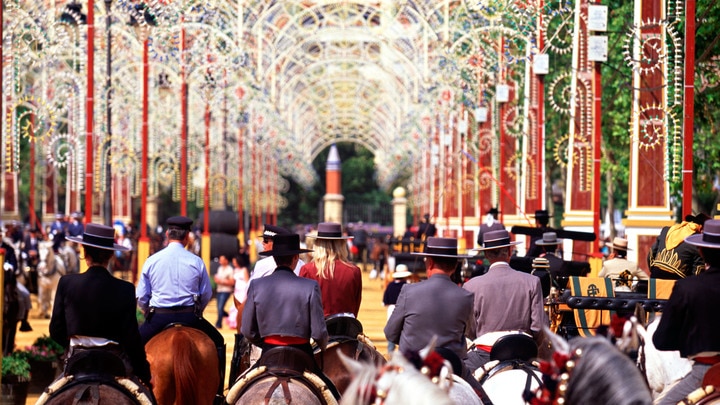 a group of people riding on the back of a horse