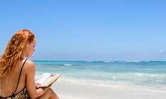 a person sitting at a beach