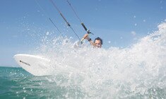 a man riding a wave on a surfboard in the ocean