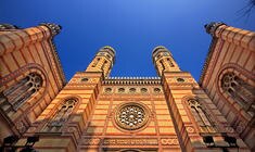 a large tall tower with a clock at the top of a building