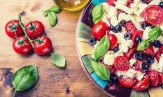 a plate of fresh fruit and vegetables on a table