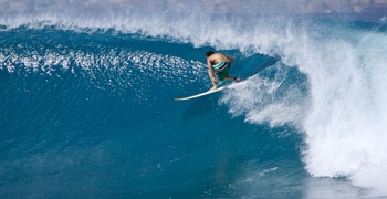 a man riding a wave on a surfboard in the ocean