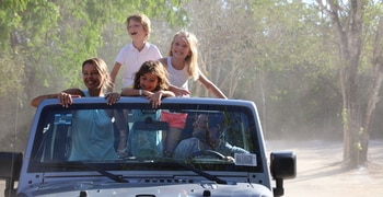 a person riding on the back of a truck