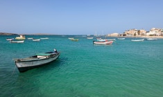 a small boat in a body of water