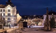 a large clock tower towering over a city