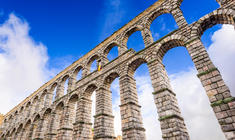 a view of a tall building with Segovia in the background