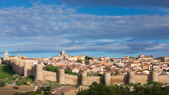 a castle on a hill overlooking a city