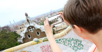 a woman looking at her cell phone