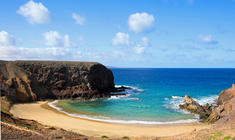 a rocky beach next to the ocean