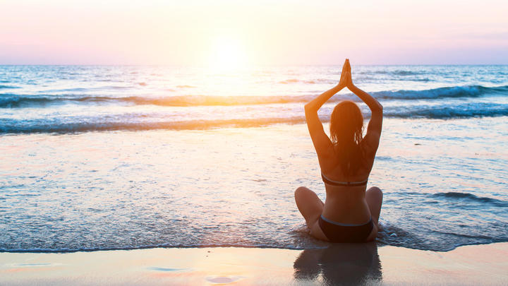 a person sitting at a beach