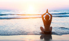 a person sitting at a beach