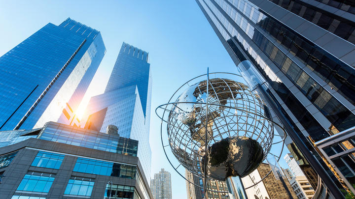 a metal tower in a city