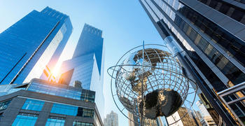 a metal tower in a city