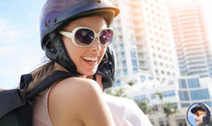 a woman wearing a hat and sunglasses