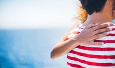 a close up of a person in a striped shirt