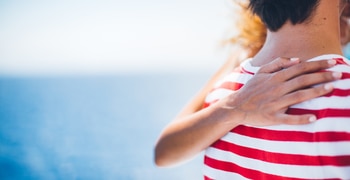 a close up of a person in a striped shirt