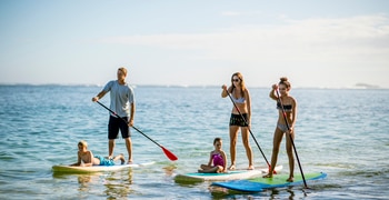 a group of people that are standing in the water