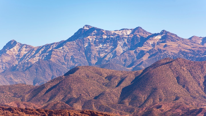 a canyon with a mountain in the background