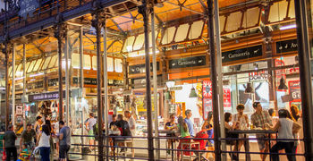 a group of people standing in front of a store