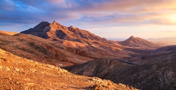 a canyon with a mountain in the background