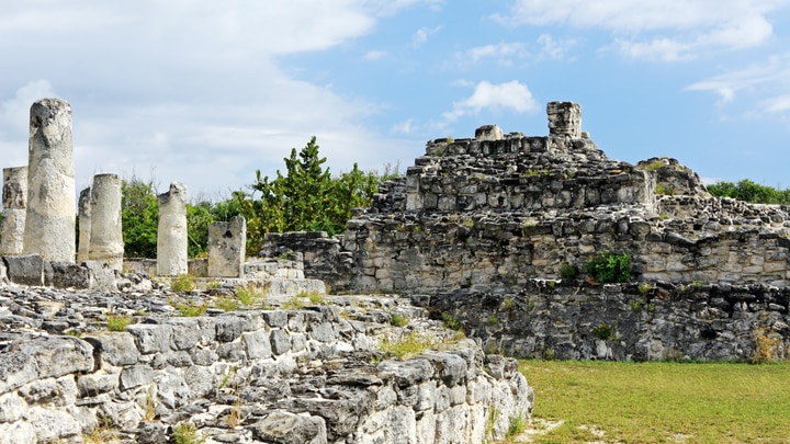 a stone castle next to a rock