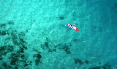 a person swimming in a pool of water