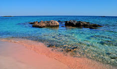 a rocky beach next to a body of water